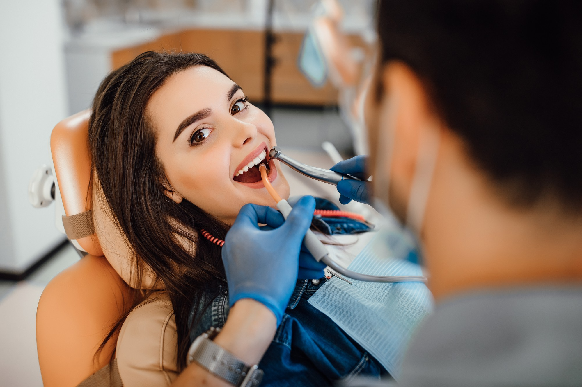 A smiling patient in the dental chair during a check-up